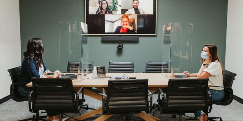 Justice HQ members meeting in conference room